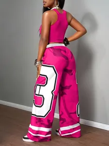 Close-up detail of magenta two-piece set with camouflage wide-leg pants and tank top