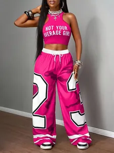 Fashion detail of pink crop top and camouflage wide-leg pants street style two-piece set