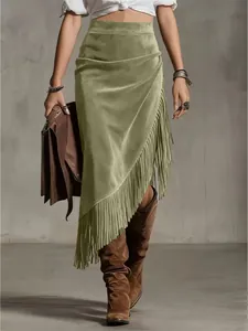 Elegant bohemian western style green suede midi skirt with detailed asymmetrical fringe hem