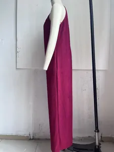 Detail side view of plum pleated sleeveless wide-leg jumpsuit on mannequin