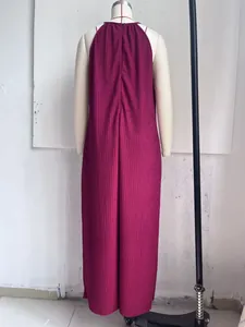 Back view of elegant burgundy pleated sleeveless wide-leg jumpsuit for vacation