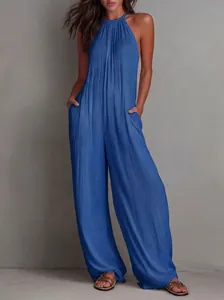 Detail view of blue pleated halter-neck jumpsuit with wide-leg design and pockets