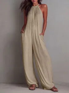 Detailed view of the pleated texture on a champagne halter neck wide-leg jumpsuit