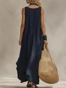 Back view of a Bohemian sleeveless navy blue maxi dress showing elegant relaxed drape