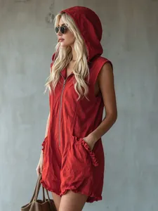 Detailed view of red sleeveless hooded romper with front zipper and ruffle pockets
