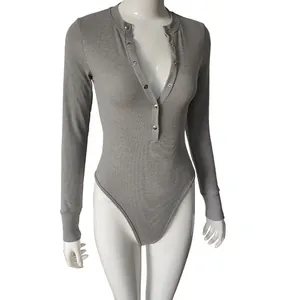Detailed view of a grey long-sleeved ribbed bodysuit with a buttoned henley neckline