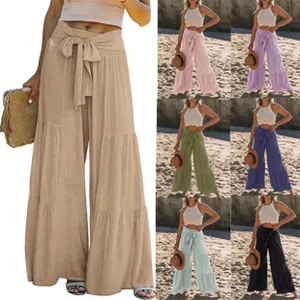 Collezione multicolore di pantaloni a gamba larga in lino a vita alta con fiocco in vita.