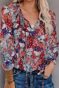 Detail of a vintage floral print V-neck blouse with ruffles for women’s casual wear.