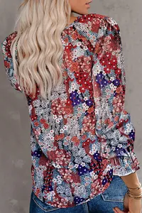 Detailed back view of a colorful floral print long sleeve blouse with ruffled cuffs