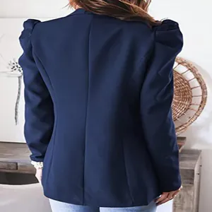 Detailed back view of a women's navy blue puff sleeve blazer featuring a tailored fit