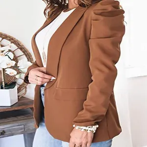 Detailed side view of women's brown puff sleeve blazer with elegant ruched shoulder design