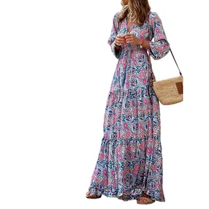 Detailed view of bohemian floral print maxi dress featuring V-neckline and tiered skirt