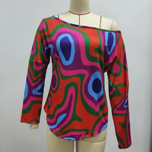 Vibrant geometric wavy print long sleeve t-shirt displayed on a mannequin torso