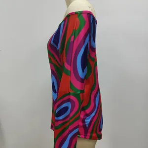 Detail side view of women's long sleeve T-shirt with vibrant geometric colorful print