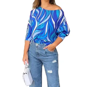 Detail view of women's loose long sleeve t-shirt with blue geometric wave print