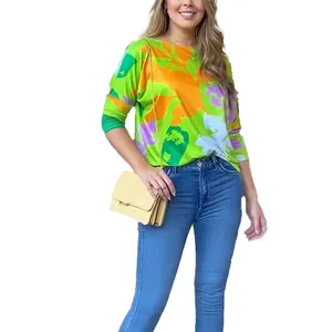 Casual women's long-sleeve tee with vibrant geometric floral print in green and orange