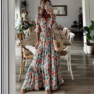 Elegant bohemian floral print V-neck maxi dress featuring a tiered skirt and tie waist