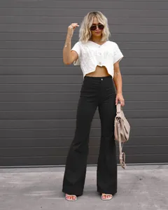 Stylish high-waisted black corduroy flare pants for women's elegant spring look