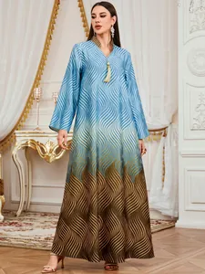 Elegant floor-length digital wave print maxi dress with V-neck and tassel detail