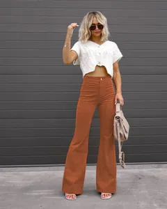 Full view of high waisted orange corduroy flare pants for a stylish spring outfit