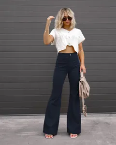 High-quality black high-waisted corduroy flared trousers for a stylish spring outfit.