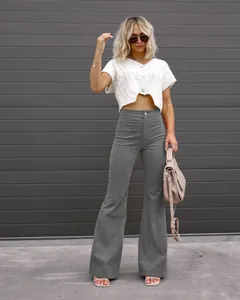 High-waisted grey corduroy flare pants for women, styled for a spring casual look