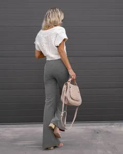 Detailed back view of high-waisted corduroy flare pants showing the fabric texture.