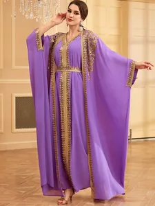 Elegant purple two-piece kaftan robe with intricate gold sequin embroidery and appliques