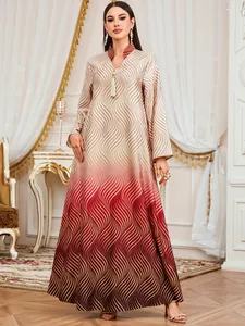 Full length elegant V-neck robe dress with wave print in luxurious interior setting.