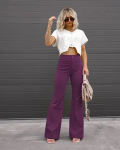 A stylish detailed look of purple corduroy high waist flare pants paired with a white knit top