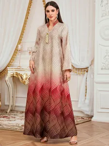 Elegant long-sleeved maxi dress featuring red gradient wave print and V-neck tassel.
