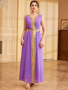 Detail of elegant purple ethnic caftan dress with gold sequin embroidery and v-neck