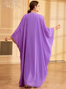 Back view of elegant purple long caftan dress with gold sequin embroidery on sleeves