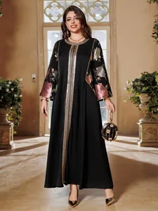Elegant black long dress with golden sequin embroidery and floral patterns