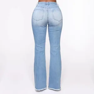 Back view of light blue high-waisted flare jeans with frayed hems and pockets.