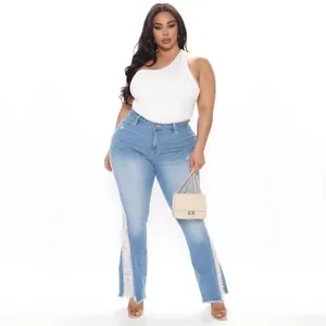 Full body view of plus size light blue flare jeans with distressed side lace panels.