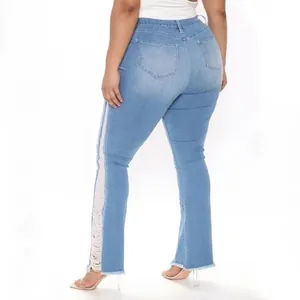 Detailed rear view of light blue plus size flare jeans featuring side distressed fringe