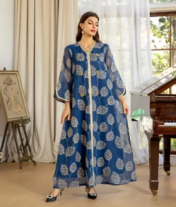 Full view of a blue mesh dress featuring gold floral embroidery and beaded buttons.