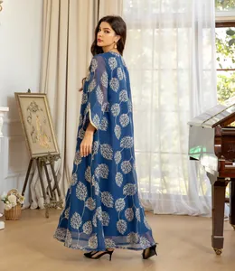 Full-length view of navy mesh dress showing intricate tree embroidery and fluid drape
