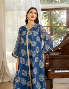 Elegant blue mesh dress with gold tree embroidery and handmade beads lifestyle view