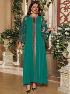 Elegant green long dress with gold sequin embroidery details on the front and sleeves.