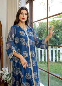Elegant blue embroidered kaftan with intricate floral patterns and hand-beaded details.
