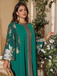 Elegant emerald green caftan with gold sequin floral embroidery and decorative trim