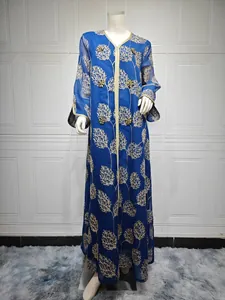Close-up of royal blue mesh dress with gold leaf embroidery and beadwork on mannequin