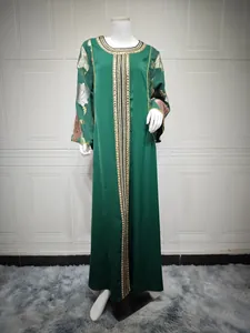 Emerald green Kaftan dress with intricate sequin embroidery and floral sleeve details