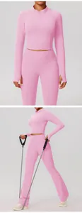 Roze yoga set met korte ritsjas met lange mouwen en uitlopende sportbroek set