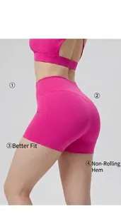 Close-up of pink high-waisted yoga shorts with butt-lifting and tummy control fit.