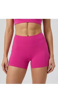 Close-up detail of hot pink high-waisted yoga shorts for women with tummy control fit