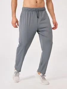 Grijze ademende sportbroek voor heren met trekkoord en zijzakken voor fitness training
