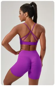 Close-up back view of purple cross-back sports bra and scrunch-butt lifting yoga shorts set.